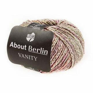 Wollknäuel von Lana Grossa in Graublau, Grün und Rosa.