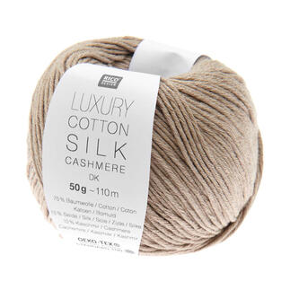 Beige Wollknäuel der Marke Rico Design mit Etikett.