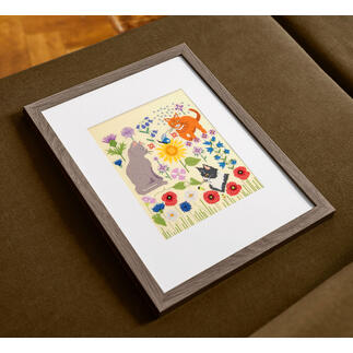Bunte Kreuzstich-Motive von Katzen und Blumen.