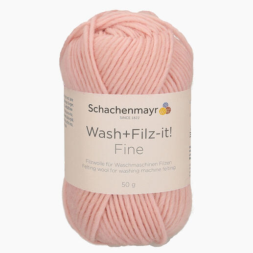 Wollknäuel 'Wash+Filz-it! Fine' von Schachenmayr in Rosa auf weißem Hintergrund.