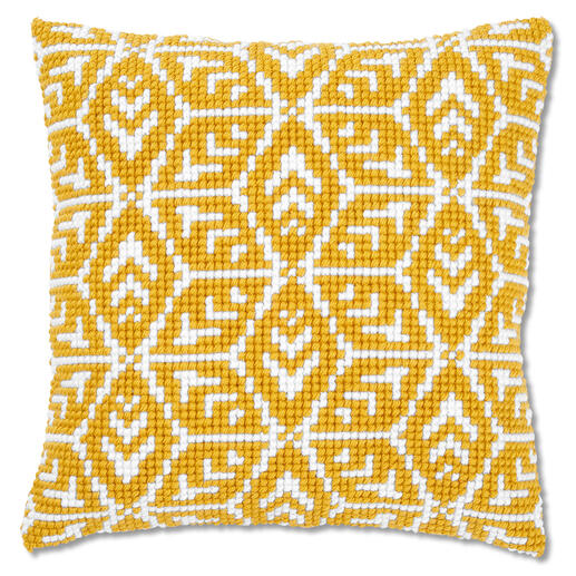 Kreuzstichkissen mit geometrischem Design in Gelbtönen.