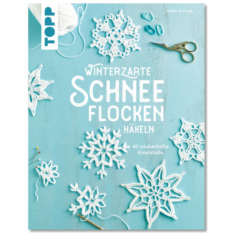 Buch über das Häkeln von Schneeflocken mit 40 Anleitungen auf blauem Hintergrund.
